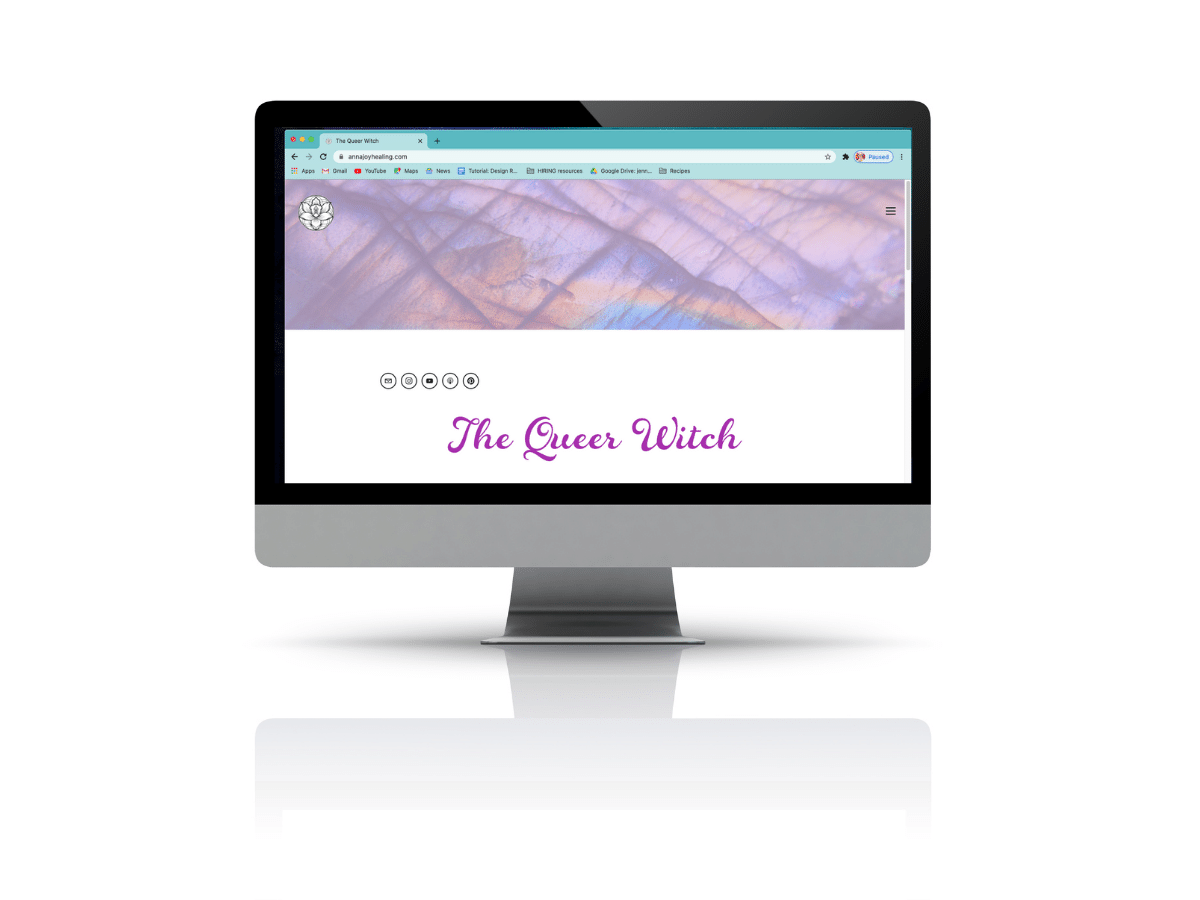 Mock up of The Queer Witch's homepage on a large desktop monitor